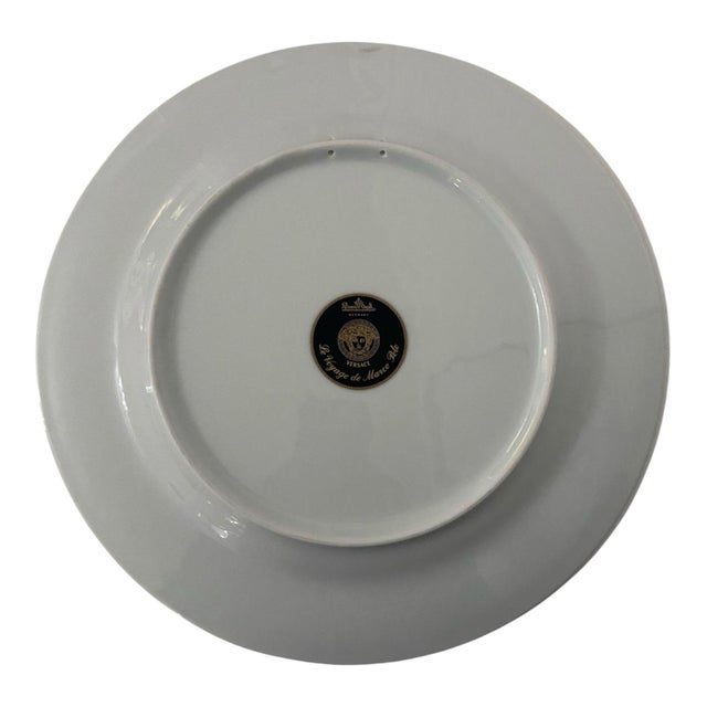 Designed in Italy by Gianni Versace for Rosenthal. "Le voyage de Marco Polo" porcelain service plate with gold decoration,...