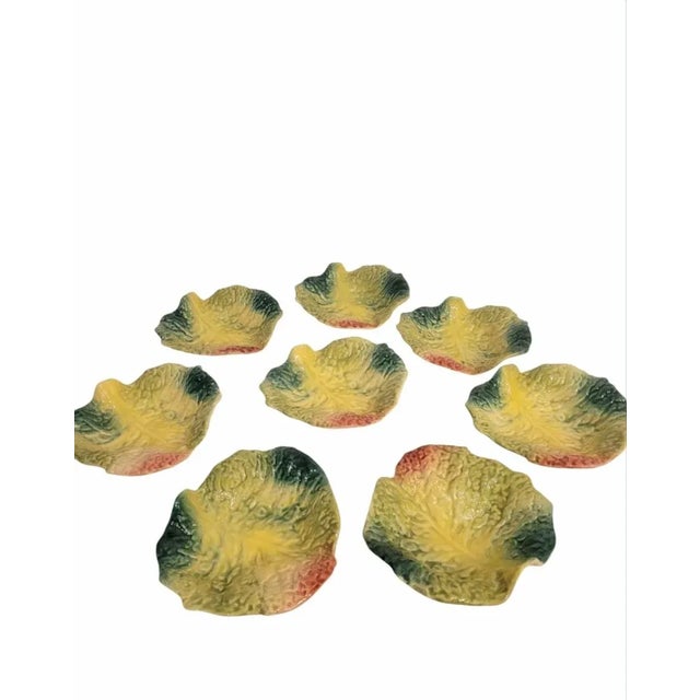A wonderful set of 8 gorgeous ceramic Italian made cabbage leaf shaped serving bowls. The bowls have a pretty cabbage leaf...