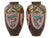 A striking pair of Japanese cloisonné enamel vases featuring bold reserves of phoenix and dragon motifs set against a...