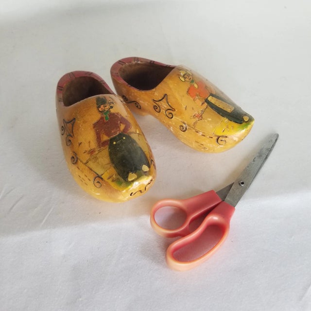 A cute pair of wooden shoes! Already outfitted and ready to hang on your walls.