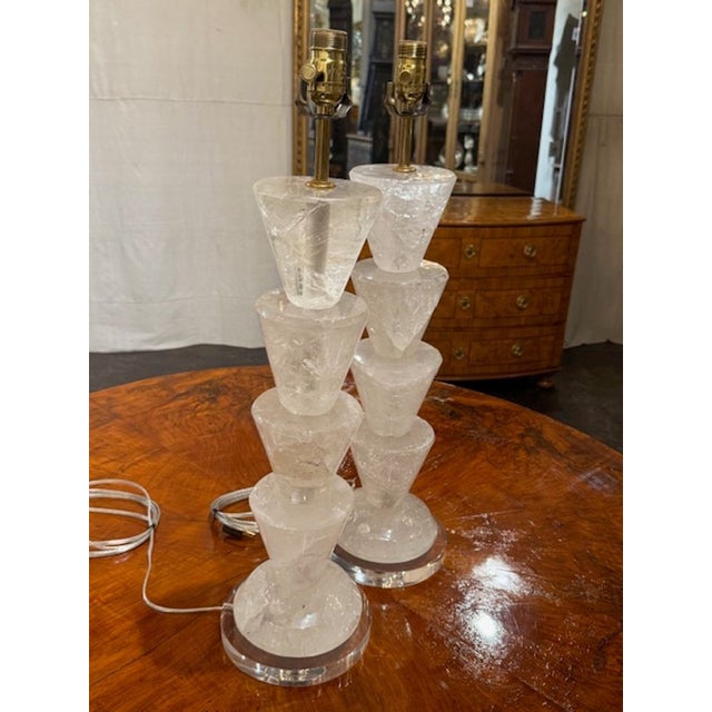 Pair of modern polished rock crystal lamps. Rock crystal lamps are beloved for their weight, clarity, and the way polished...