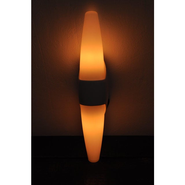 Beautiful, bauhaus-inspired wall lamp from the 1960s, designed and produced by the belgian company bo-niko. The large,...