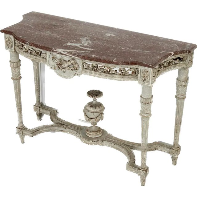 Antique Louis XVI style painted wood console, 19th Century, France. Grey painted carved wood, rouge breche marble, the...