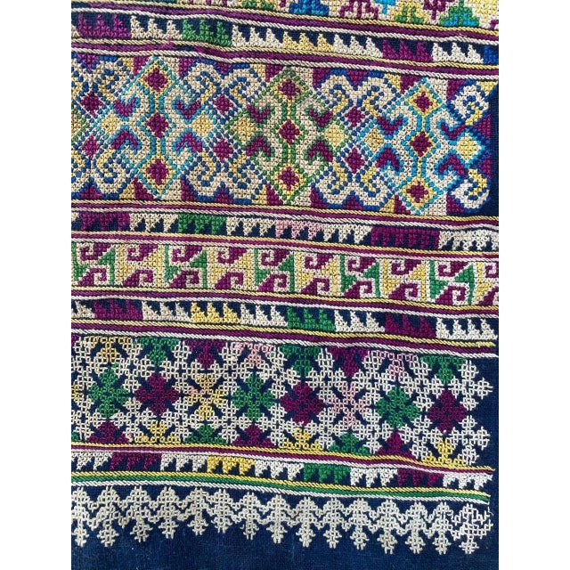 Very nice early 20th Century embroidery with a tribal design and beautiful colors, entirely hand embroidered with silk on...