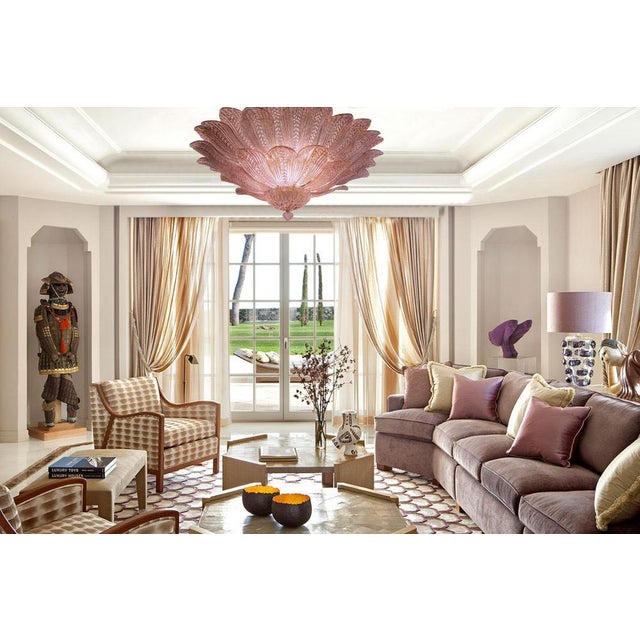 Realized in pure pink amethyst color Murano glass consists of 45 delicious hand-blown leaves. The structure is gilt-metal....