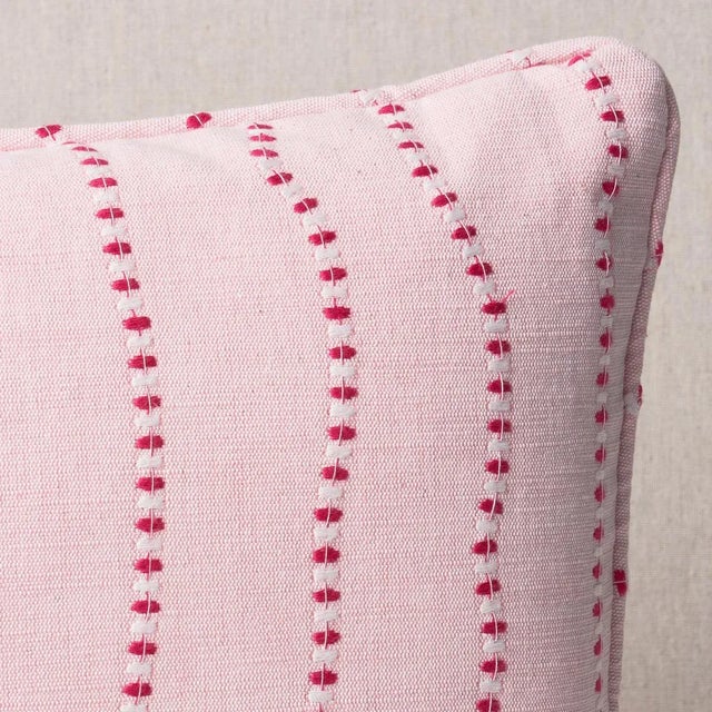 This pillow features Elodie Embroidery with a self welt finish. The wavy lines stitched in alternating thread colors make...