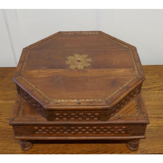 Double height carved Indian box An unusual piece with 2 levels, the top of the box in the octagonal shape has an opening...
