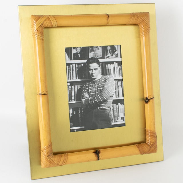 This luxury brass and bamboo picture frame was crafted in Italy in the 1970s. The rare sophisticated design boasts solid...