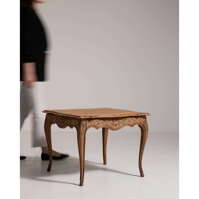 Rendered in warm, honey-toned oak, this French coffee table embodies the graceful romanticism of the Louis XV style with...