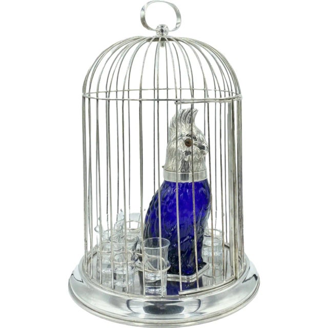 Details: -Set comes with 1 silver-plated birdcage, 8 clear shot glasses, and 1 cobalt blue cockatoo glass decanter/claret...