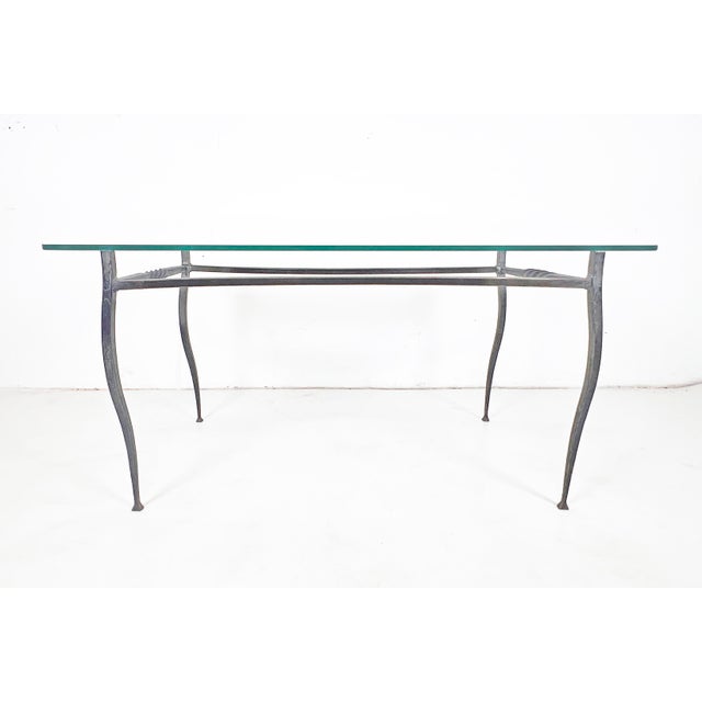 A wrought iron coffee table fashioned in the 1970s by the renowned New England blacksmith artisan Lance Cloutier. Known...