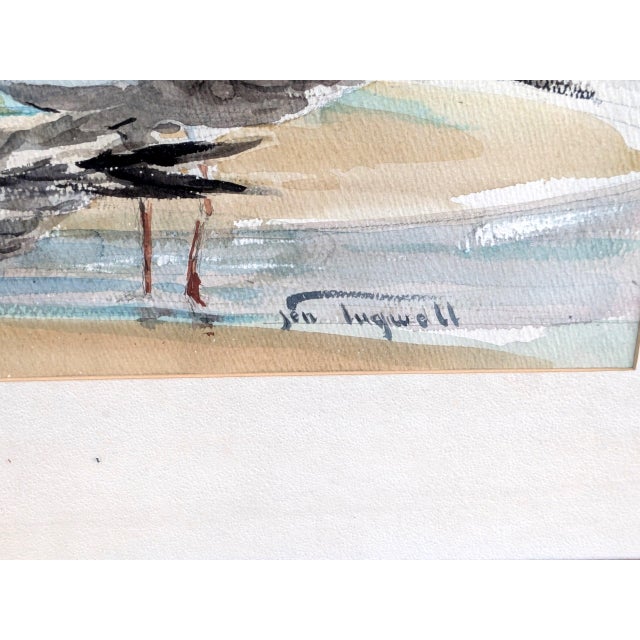 Charming vintage watercolor painting depicting a group of seagulls along the shoreline. Signed by artists near bottom...