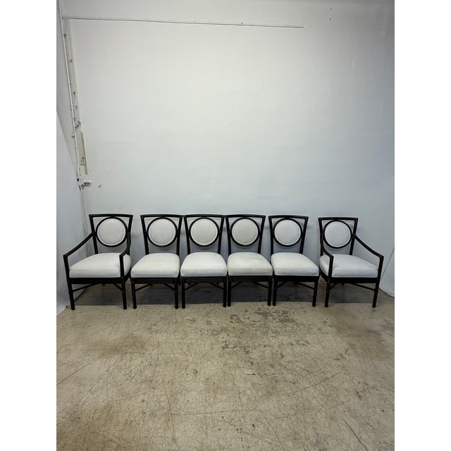 Set of six McGuire bamboo and leather frame dining chairs with fabric seats and backs. The fabric is original and requires...