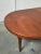 Round teak table set with two extensions, with four matching Moller chairs. Ideal for a dining room or kitchen. – Wooden...