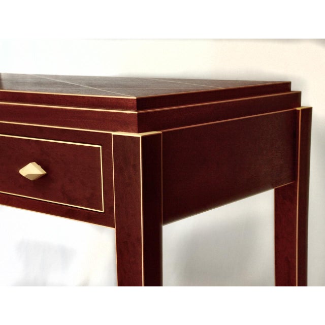 David Marr's Pommele Sapele and Holly design beautifully combines the rich, intricate patterns of sapele wood with the...