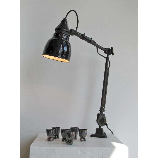 Wonderful articulate German task lamp by Rademacher, fully adjustable with fixation to a tabletop or optional to a steel base