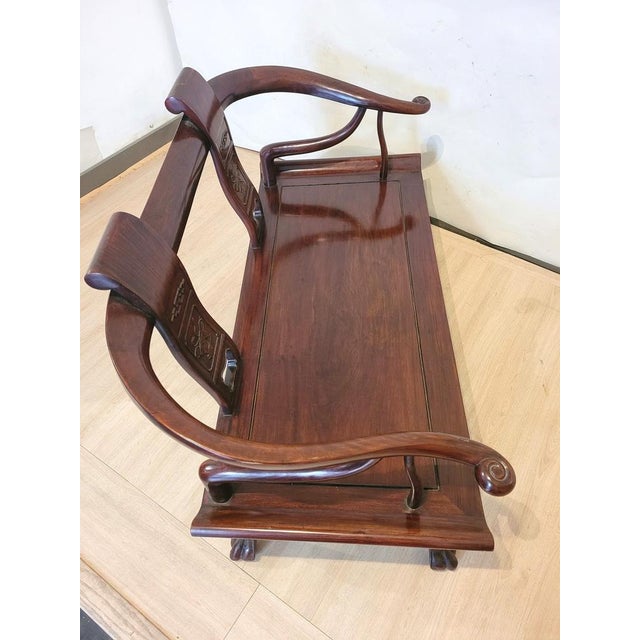 Very nice Chinese carved wooden bench: the backrest comes back forward to form the additions and end in snails, the...