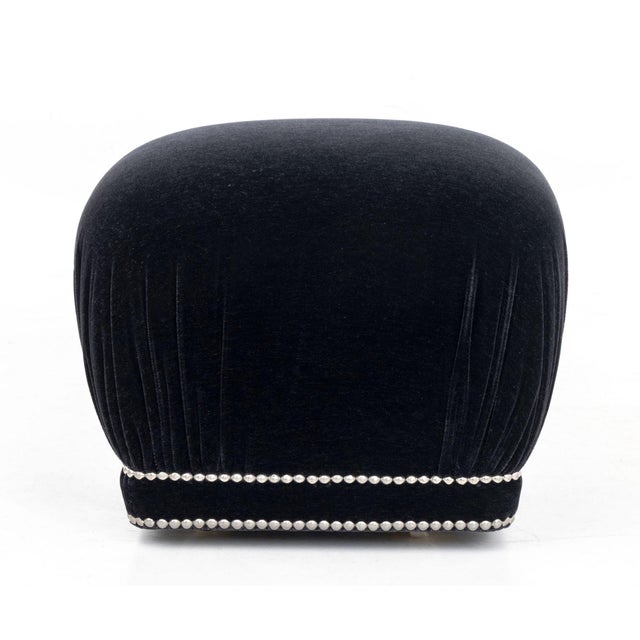 Modern Black Velvet Upholstered Ottoman, with studded nailhead details above four casters. 13" H x 17.5" W x 17.5" D....