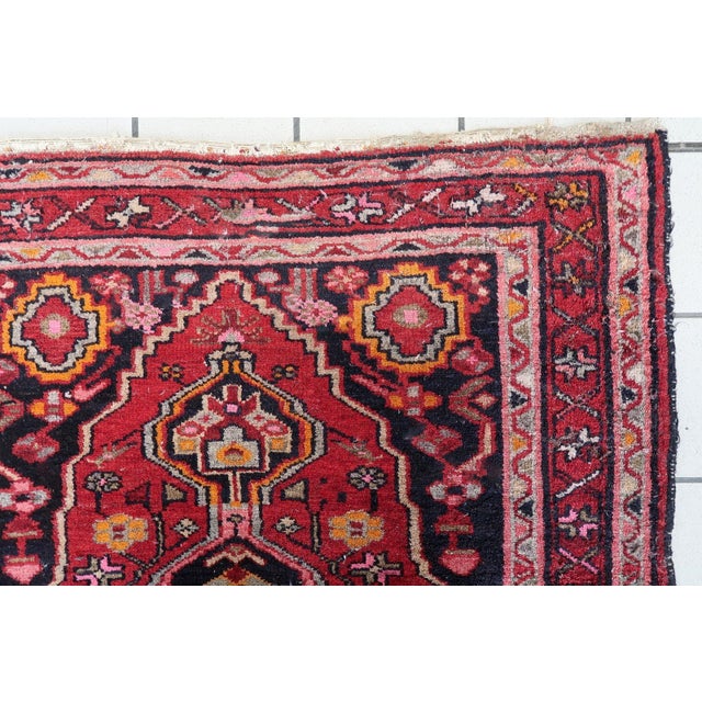 A magnificent antique Persian Hamadan rug from the 1920s, exemplifying the rich weaving traditions of the Hamadan region...