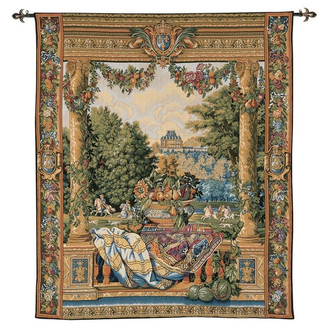 This tapestry is one from a series depicting French Royal Palaces and representing the twelve months of the year. Over the...