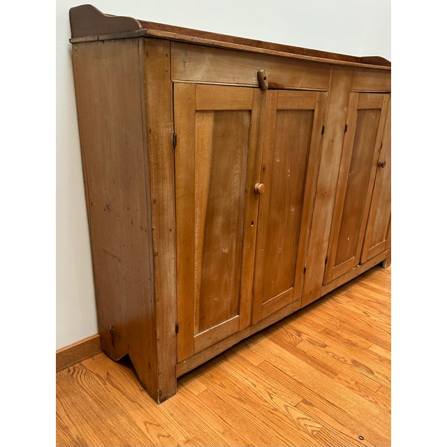 My family purchased this primitive antique cabinet from a Shenandoah Valley antiques dealer in the 1990’s. It is thought...
