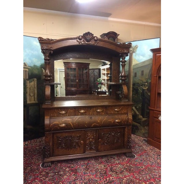 Item: Antique Oak Buffet with Mirror. Age & Condition: Circa 1900-1910. Refinished and restored. Beveled Mirror replaced...