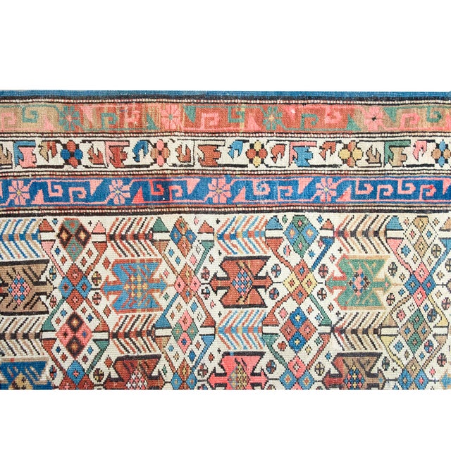 This antique Caucasian Kazak rug, dating to the late 19th century, features an exceptionally detailed geometric...