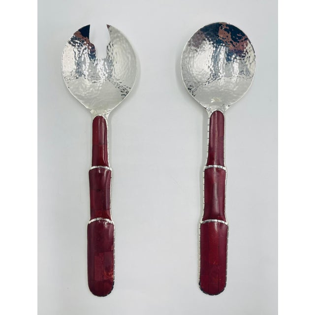 Striking and highly collectible serving utensil set designed and handcrafted in the 1980s in Taxco, Mexico by renowned...