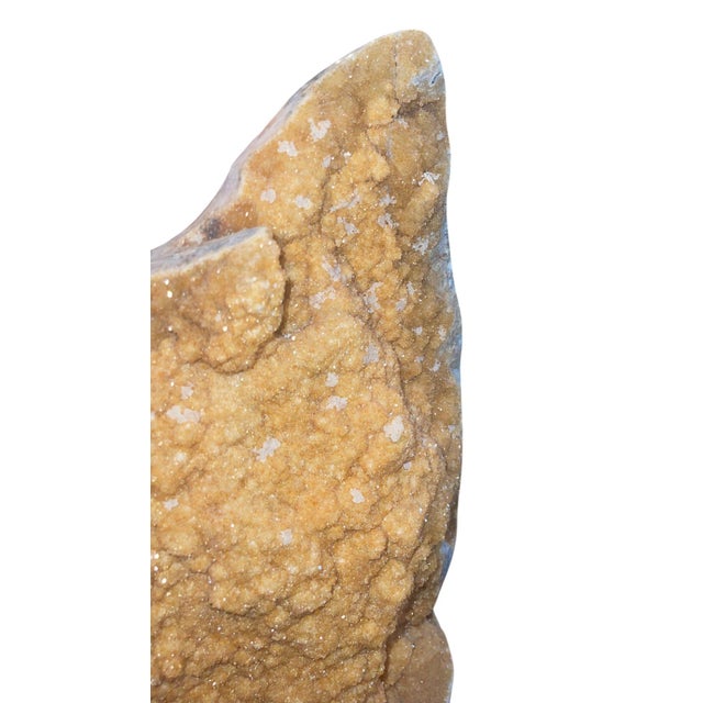 A striking large-scale natural citrine quartz crystal specimen mounted on a custom carved wooden display base. This...