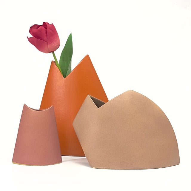 Elevate your interior curation with this exceptional, highly collectible trio of sculptural ceramic vases by acclaimed...