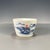This is a charming vintage porcelain teacup, decorated in the classic blue and whitepalette with accents of underglaze...