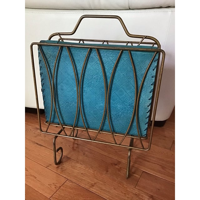 Strong and sturdy, two compartment, Mid Century magazine/album rack with geometric lines and brass finish.