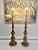 Striking pair of tall vintage brass table lamps featuring an elegant, architectural baluster form with beautifully...