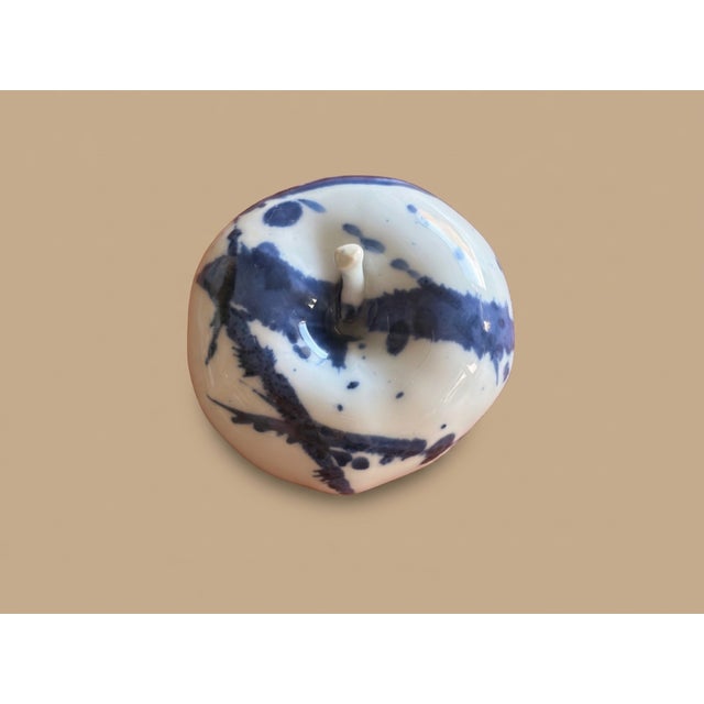 Elevate your collection or minimalist interior with this exquisite hand-painted porcelain apple sculpture. "Ping: Peace &...