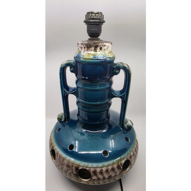 Elevate your interior with this double-light floor lamp crafted from ceramic and lava stone in a stunning blue! Its...