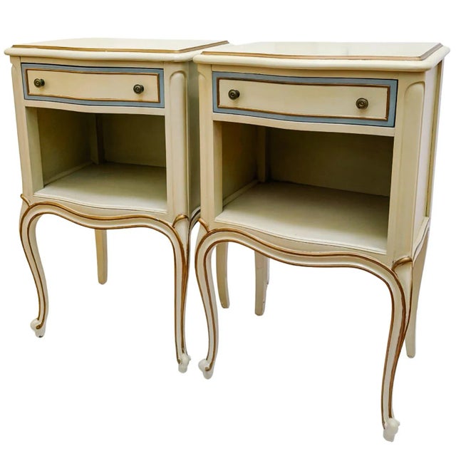 Pair of 1950s American-made French Provincial Louis XV style nightstands by Drexel from the celebrated Touraine...