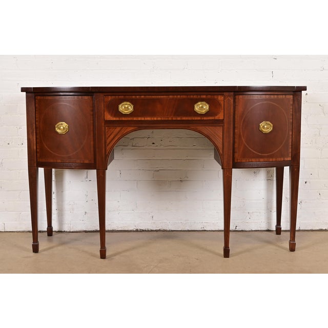 An exceptional Georgian, Federal, or Hepplewhite style sideboard buffet or credenza By Baker Furniture USA, Circa 1980s...