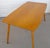 Vintage mid century modern wooden dining table made by Henry Roberts Furniture of Brisbane, Australia. The table top is...