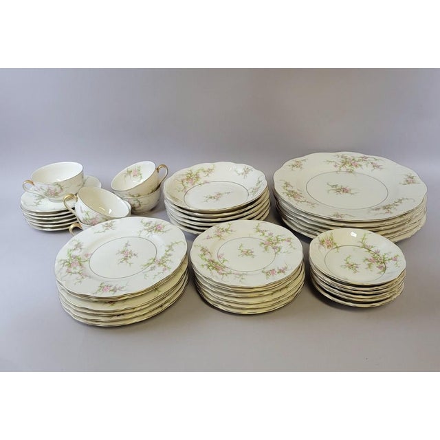 A beautifully complete 42-piece dinnerware service in the Rosalinde pattern by Theodore Haviland, made in America and now...
