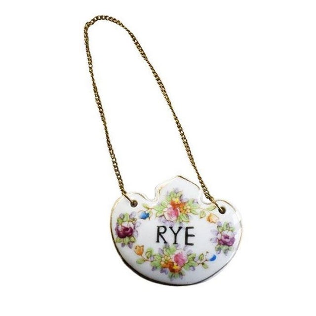 A porcelain decanter tag with a metal chain by Amari Creations Japan. A stunning victorian piece that will be fabulous on...