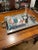 This large, rectangular tray is silver plate over copper and made in India. (We had the metals identified at a silver...