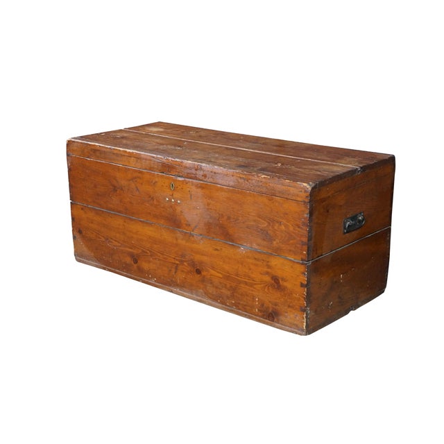 This rustic antique primitive pine blanket chest showcases the rugged utility and honest craftsmanship of early American...