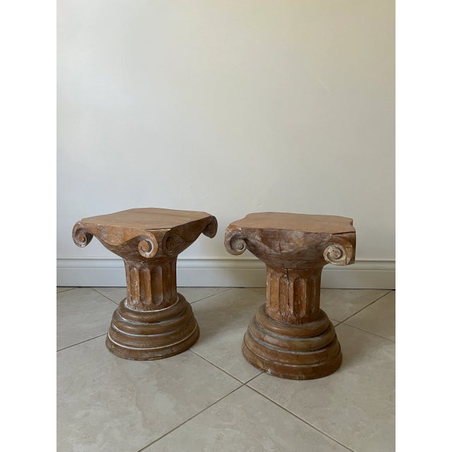 Antique hand carved wooden column pedestals or accent tables. The low profile tables each have unique characteristics as...