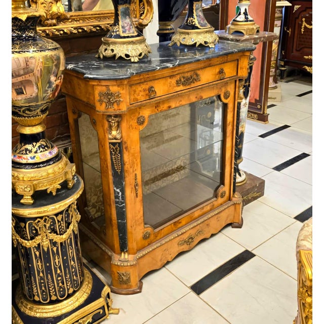 Elevate your interior with this magnificent French Louis XVI Display Commode Cabinet, an elegant statement piece that...
