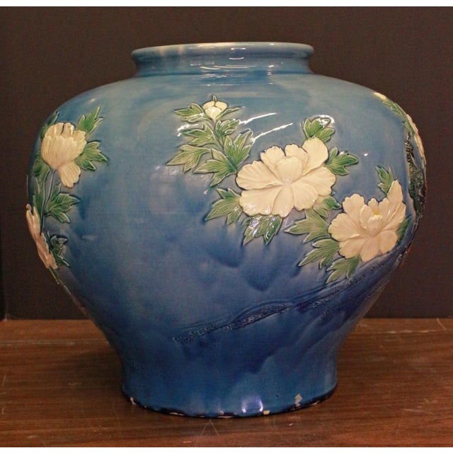 Large ceramic peacock decorated vase, likely early 20th century Japanese. Bulbous form to lipped opening. Blue ground...