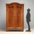 Piedmont walnut wardrobe dating to the late 19th century, an example of quality Italian craftsmanship. The front features...