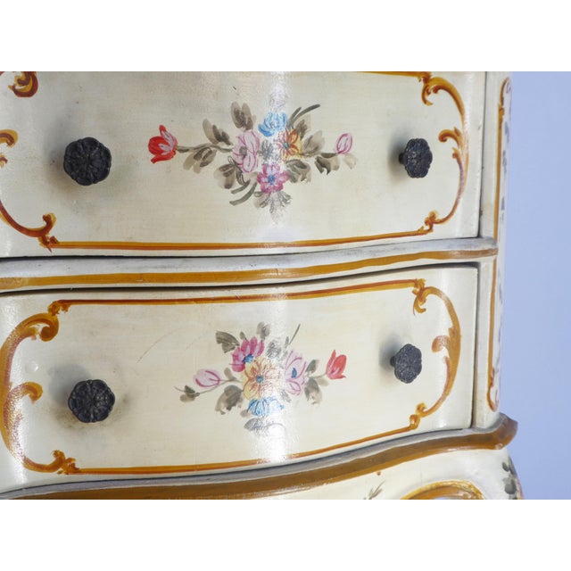 A Venetian chest of drawers hand painted with floral details. The beautiful Florentine chest has nice curved legs and...