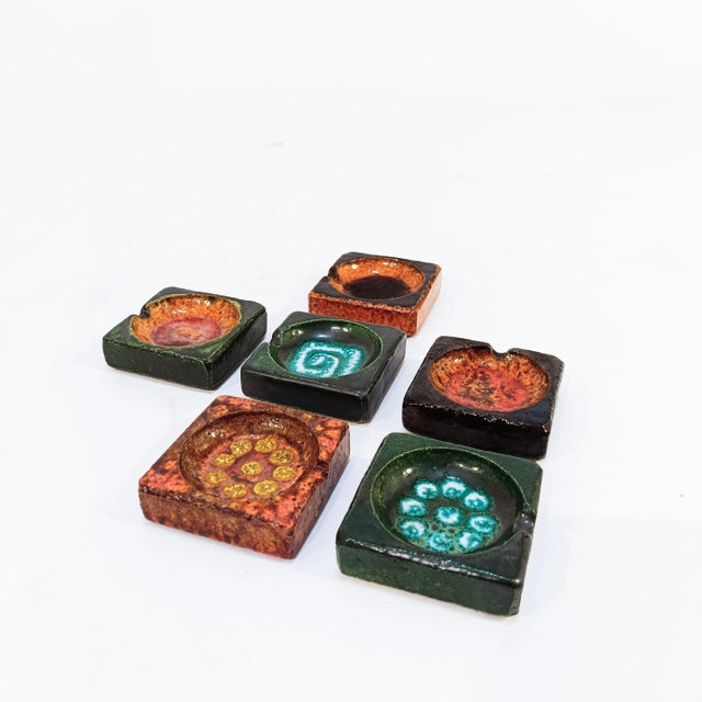 German ceramic ashtray set, 1970s. Ashtray set consisting of 6 multicolored pieces. Square in shape and fat lava style,...
