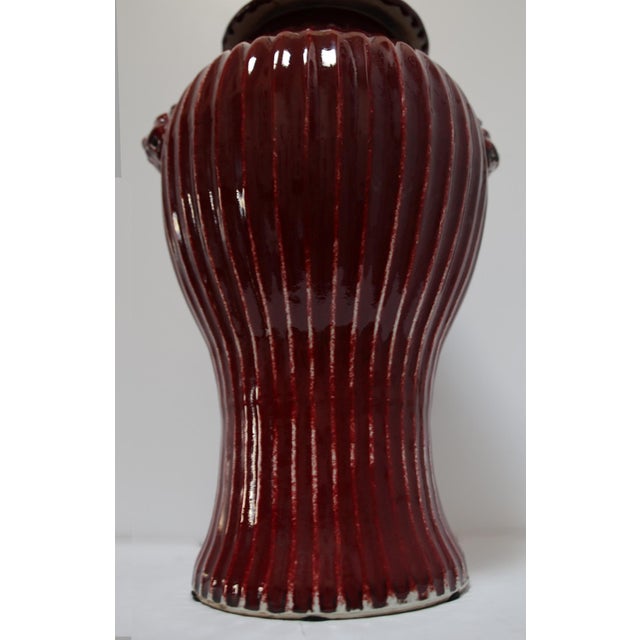 A Chinese Foo Dog Ginger red-copper glazed jar circa 1900 is ready for installation. The jar itself has a distinctive...