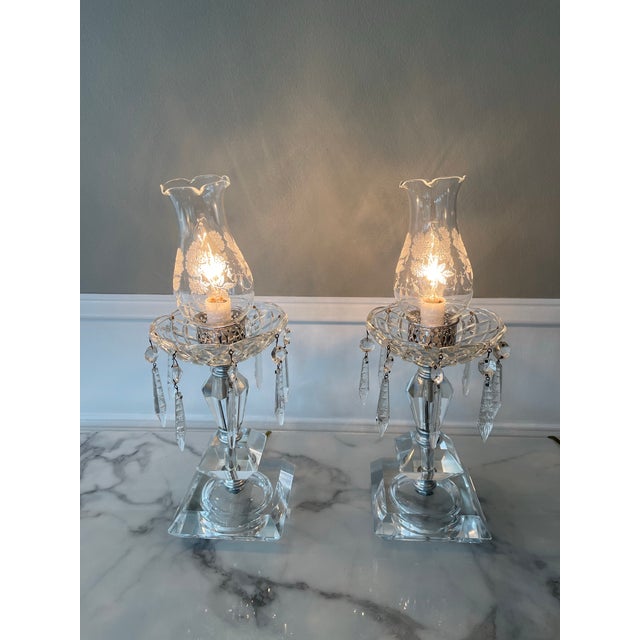 Pair of Vintage crystal hurricane lamps. Newly refurbished to bring these beauties back to their former glory. Etched...